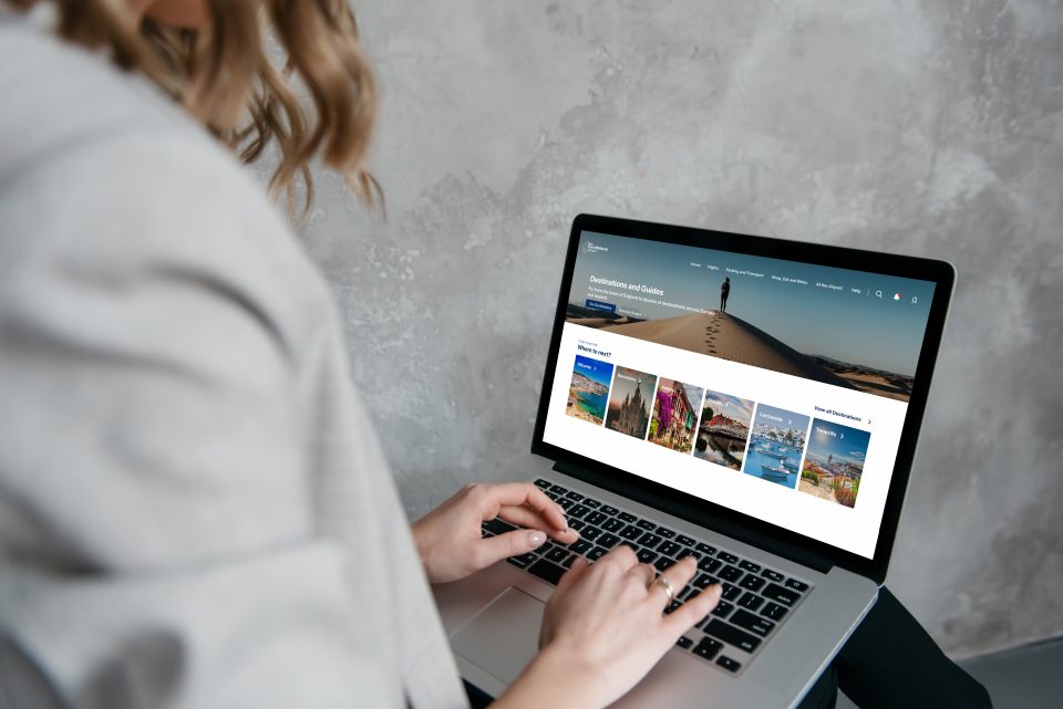 Woman viewing East Midlands Airport website on desktop